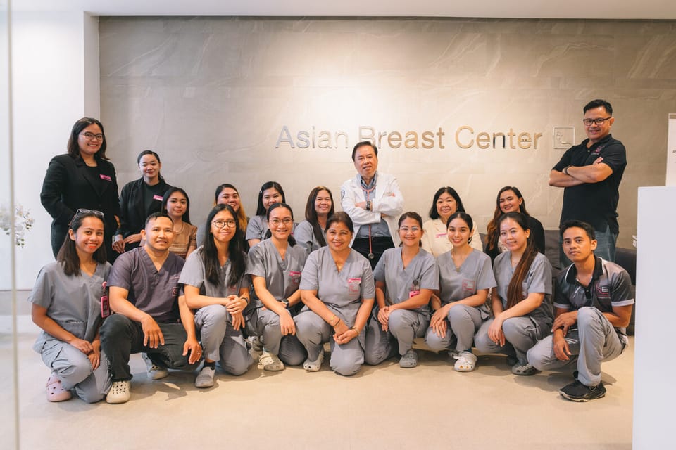 Dr. Norman San Agustin at Asian Breast Center with the center staff.